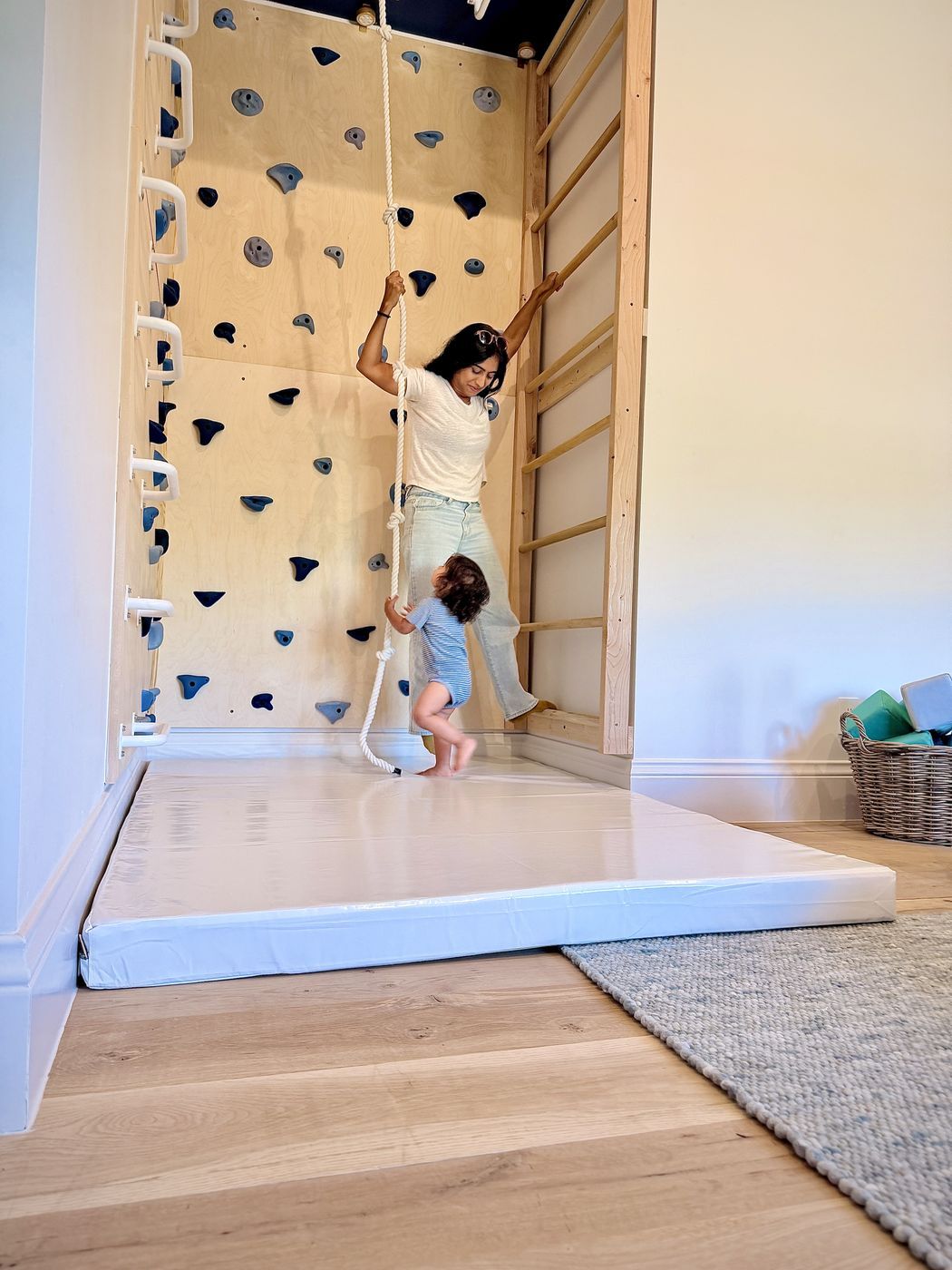 Adult child climbing rope