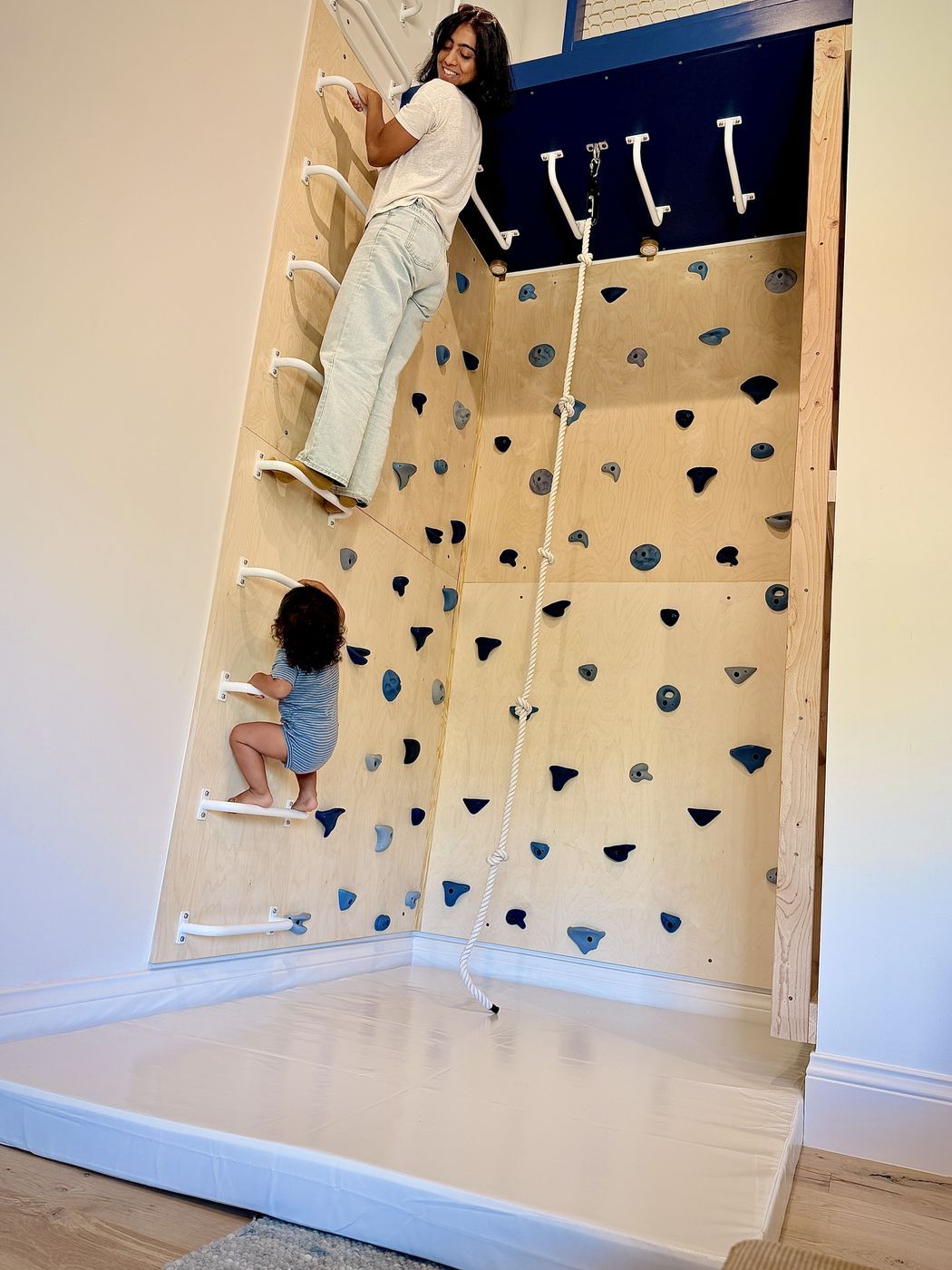 Adult child climbing wall bars