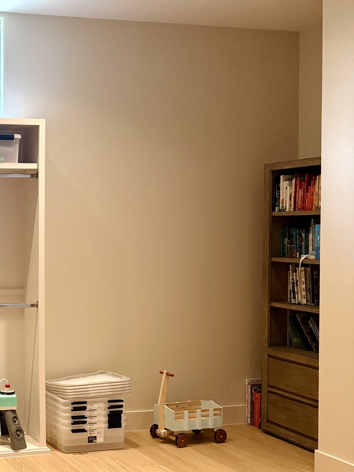 Before: the empty corner with a bookcase and a few toys