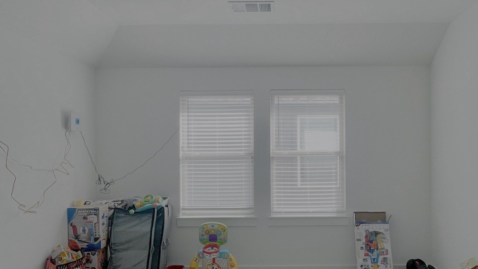Before: the same room, empty but for a few toys