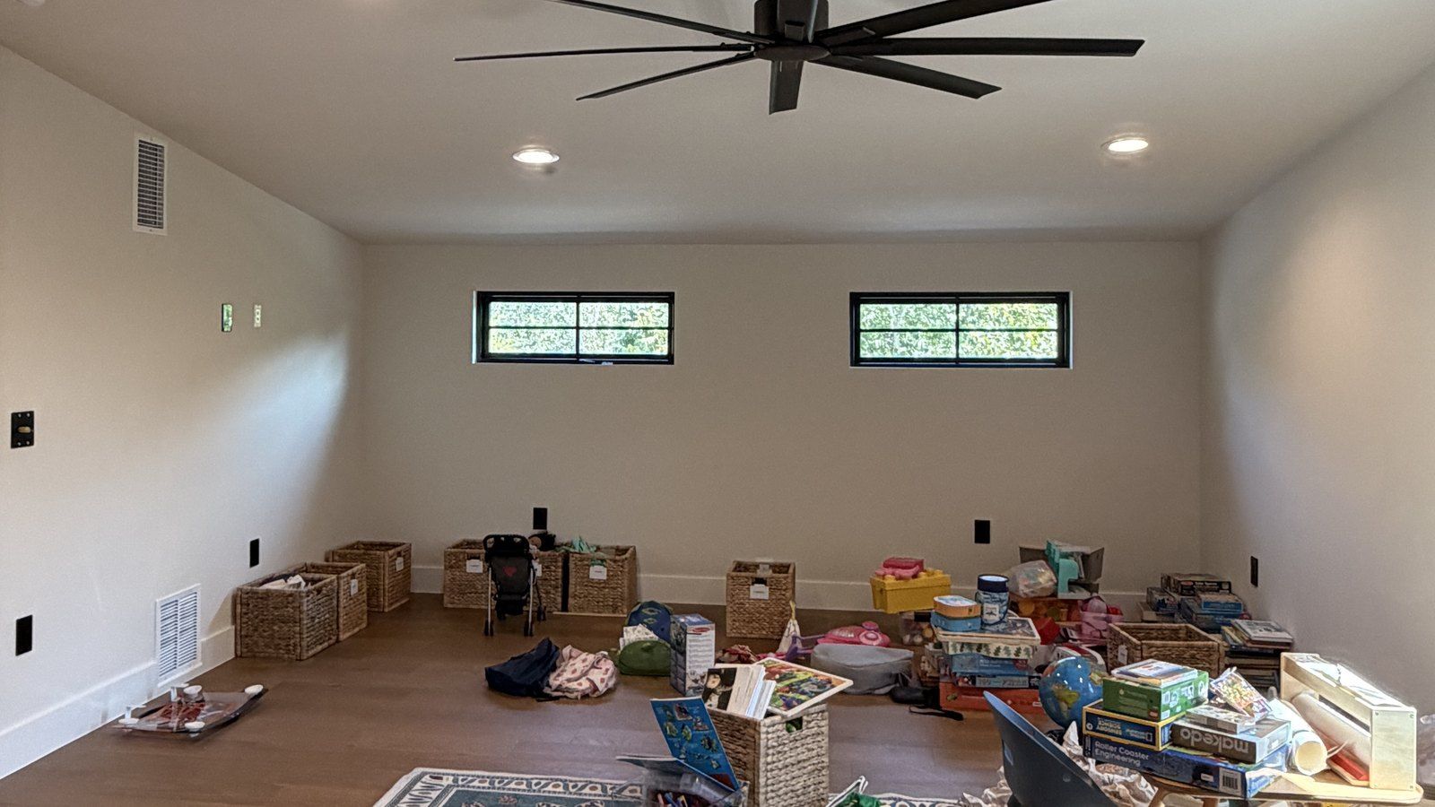 Before: the same room, empty but for baskets and toys
