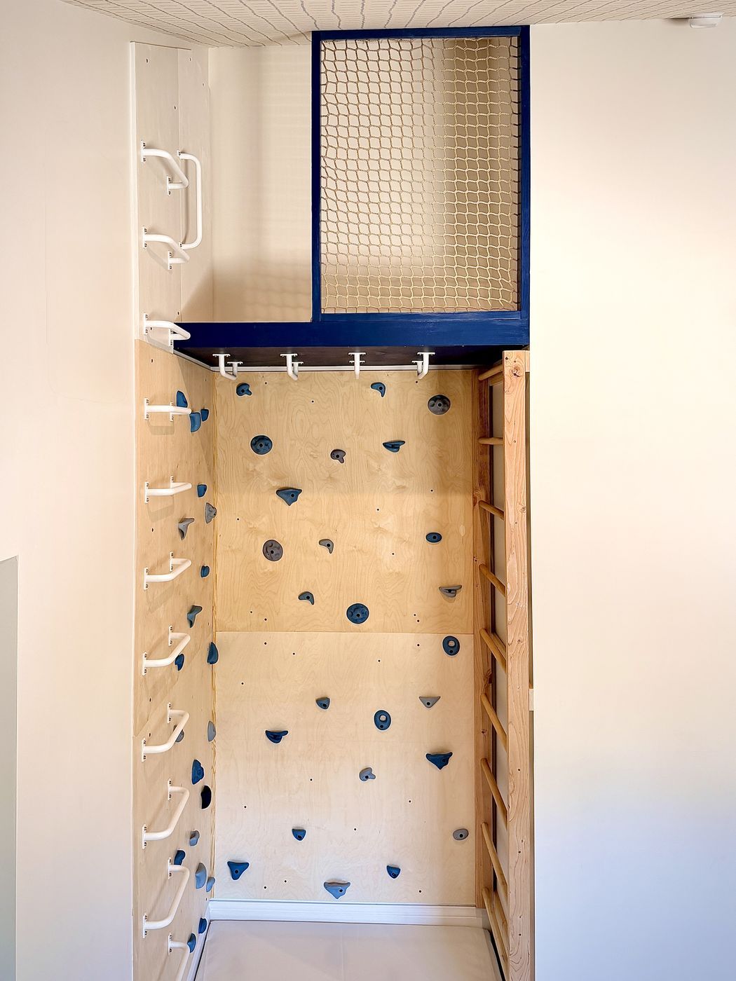 Blue netted loft above climbing wall