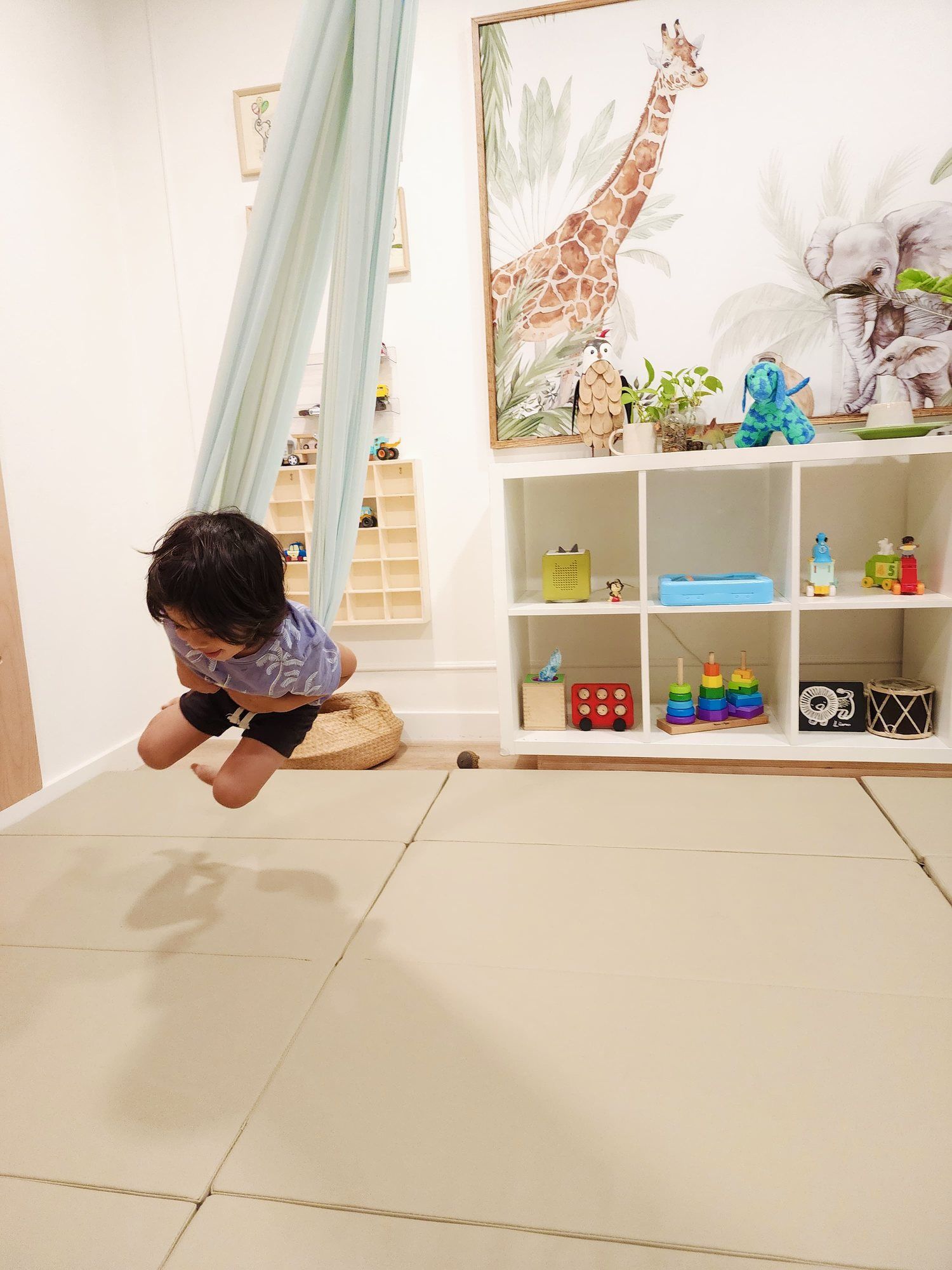 A child flying in the fabric swing