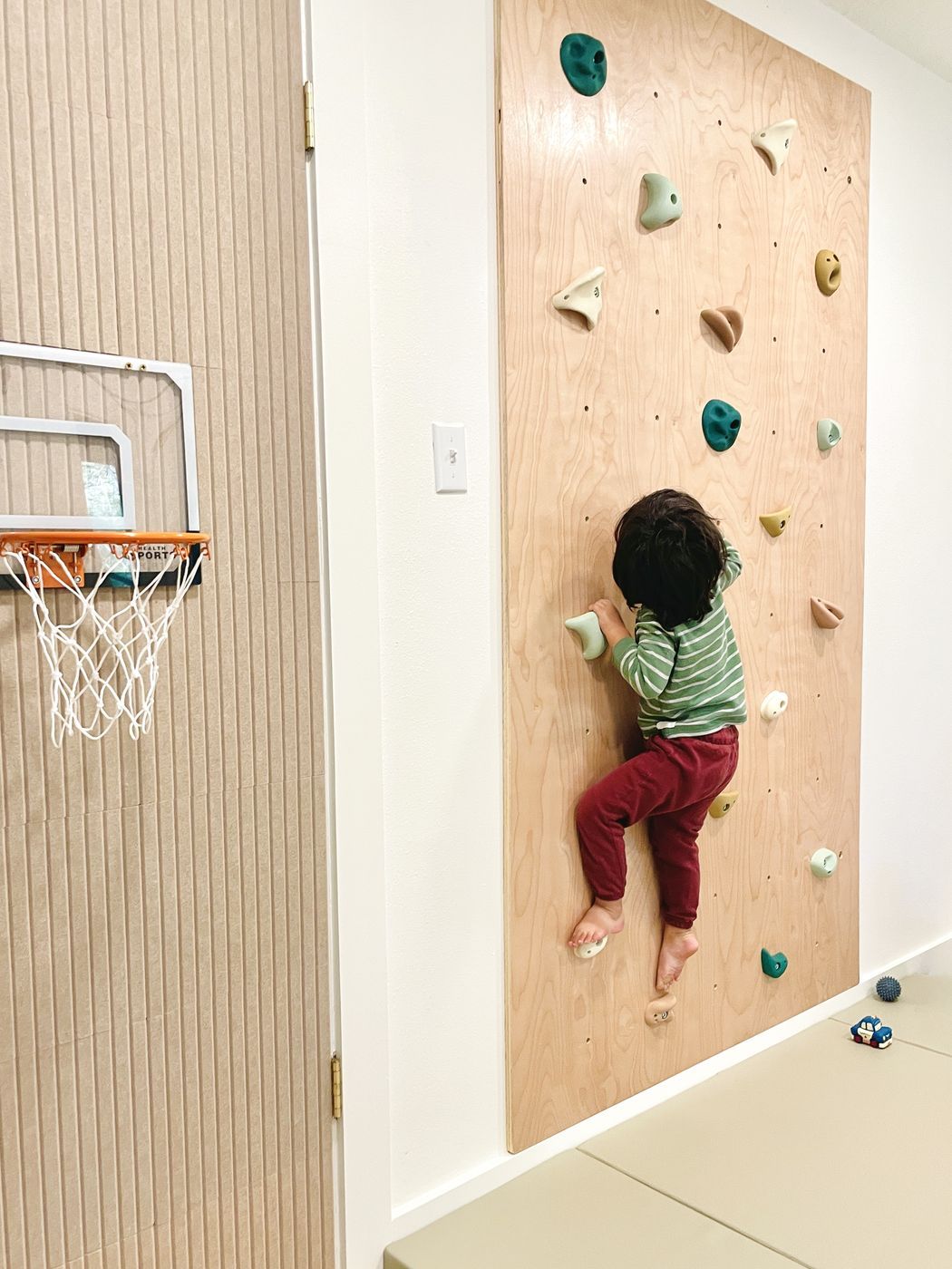 Child on indoor rock climbing wall