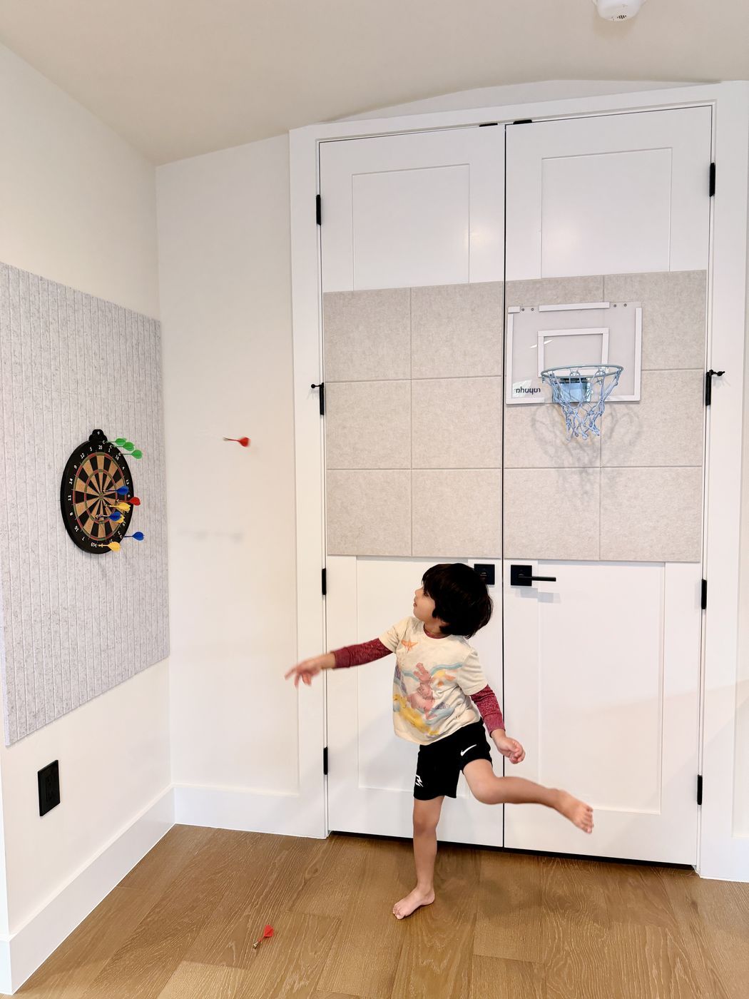 Child playing dartboard game