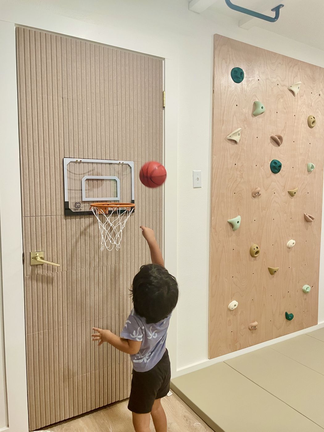 Child playing indoor basketball