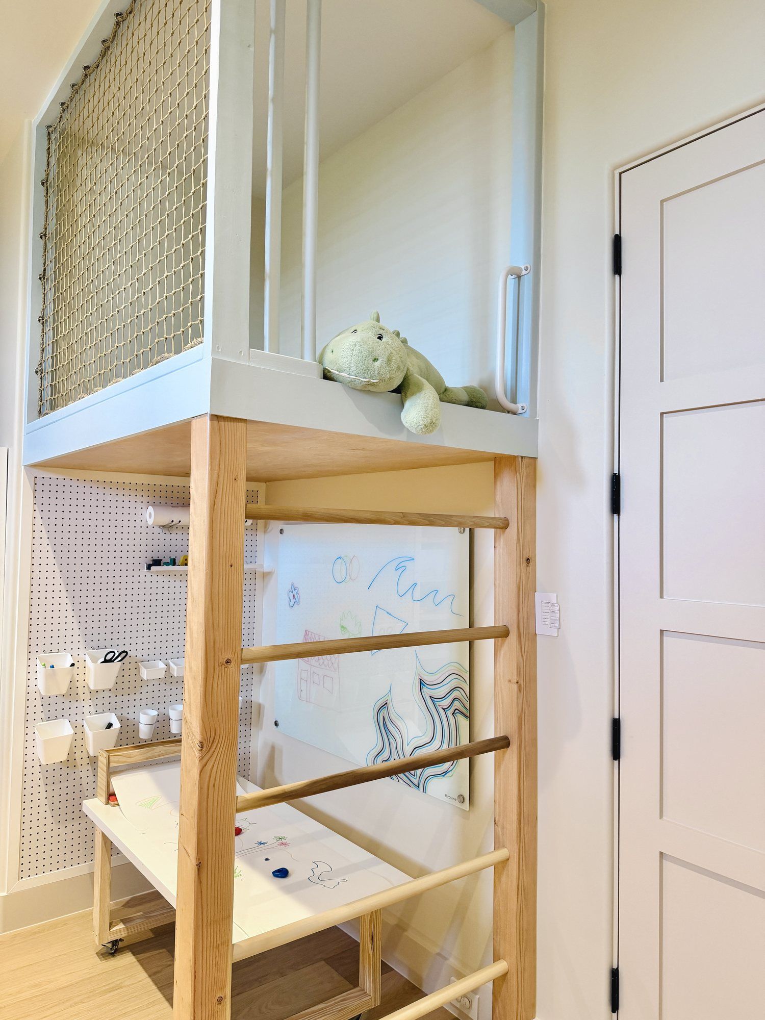 The wooden ladder up to the loft, above the art zone