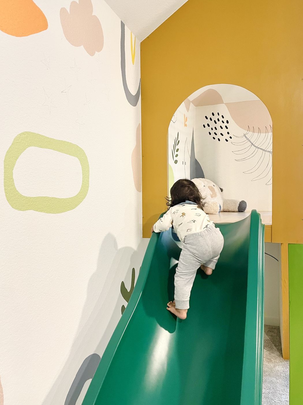 Toddler climbing indoor slide